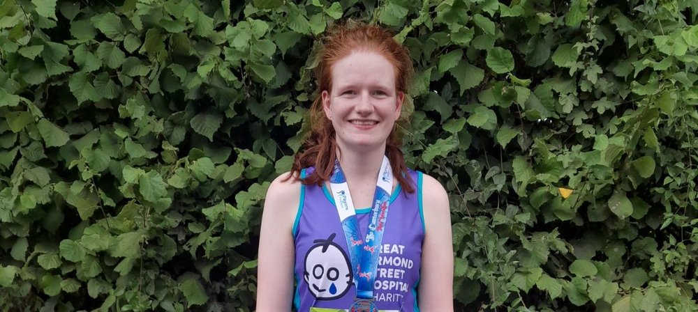 Amy with her medal having taken part in the Canterbury Half Marathon for GOSH Charity in August 2022