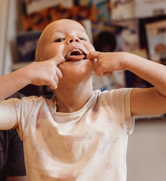 A little girl sticking her tongue out