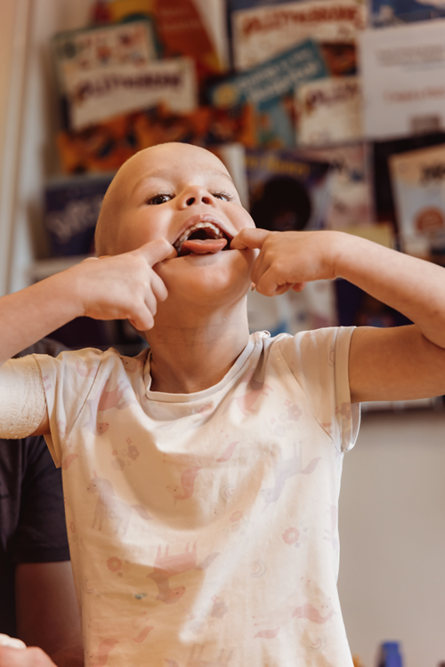 A little girl sticking her tongue out