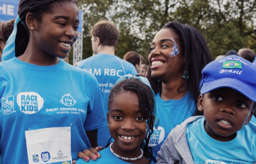 Family smiling to camera at Race for the Kids