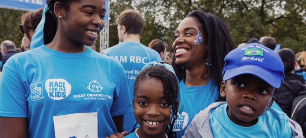 Family smiling to camera at Race for the Kids
