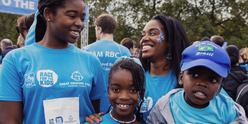 Family smiling to camera at Race for the Kids