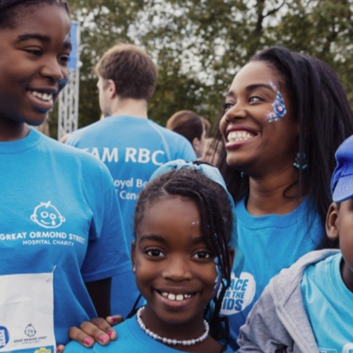 Family smiling to camera at Race for the Kids