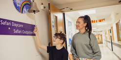 Boy ringing end of treatment bell