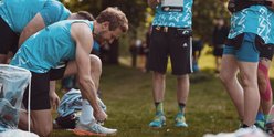 London Marathon runner tying shoelaces before the event
