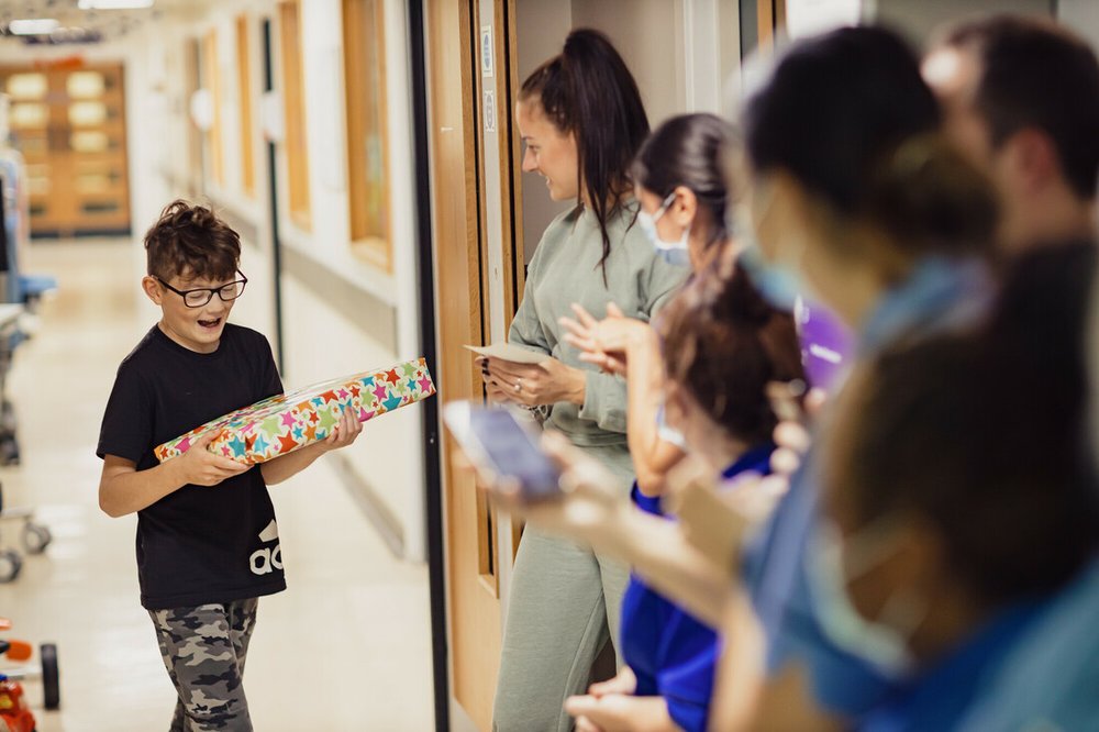 Harley receiving a present from staff
