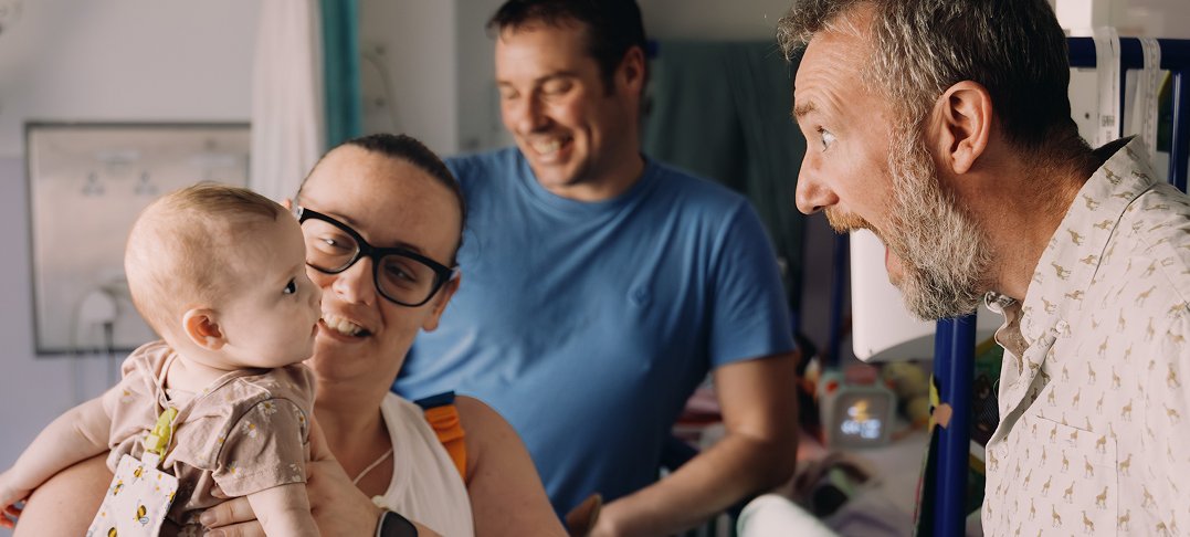 Baby in hospital room smiles at Taskmaster host Alex Horne