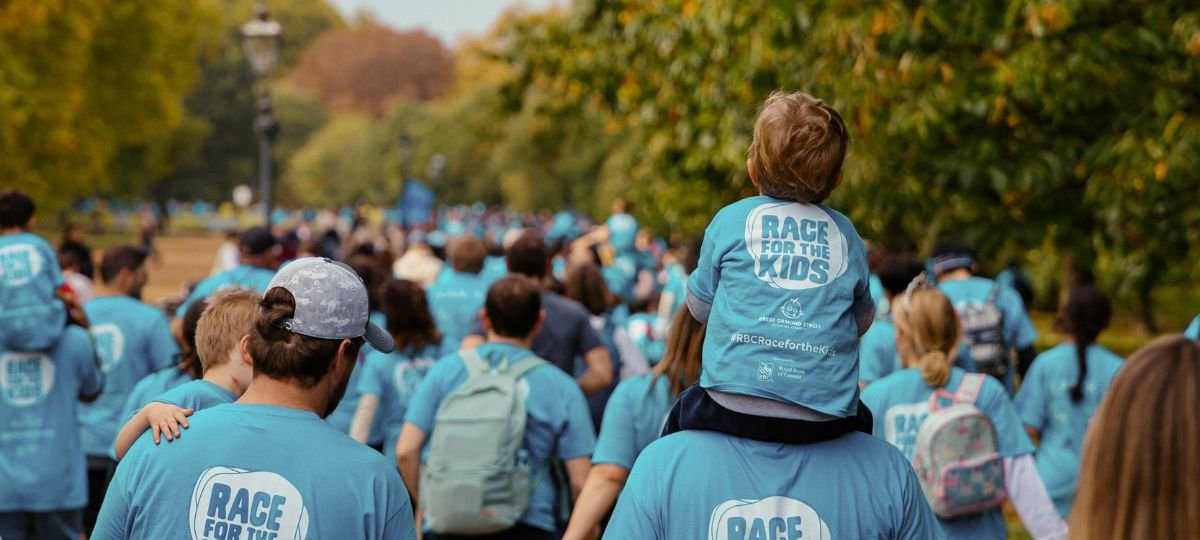 Participants on the RBC Race for the Kids route in Hyde Park. It is autumn.
