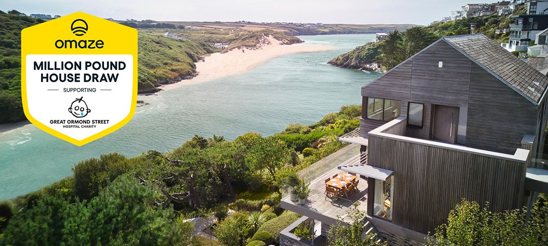 House by the sea with Omaze logo