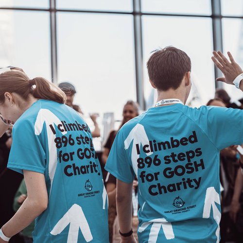 Two runners receiving their medals for the Walkie Talkie Tower Climb
