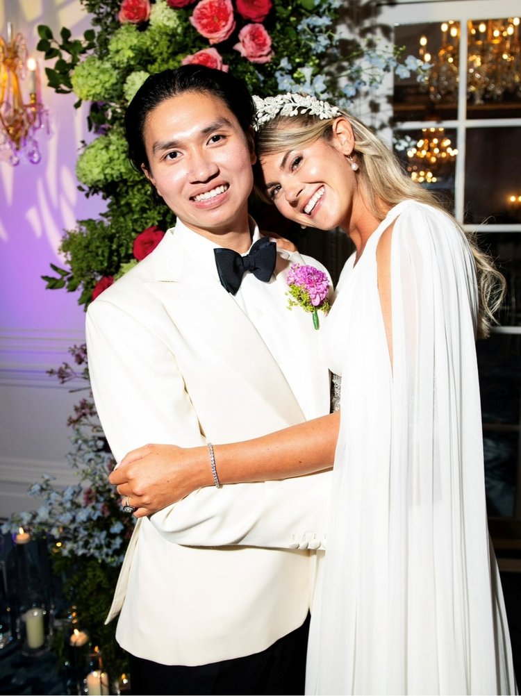 Wedding couple smiling and posing for photo