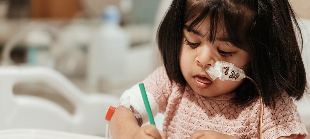 Zarwa colouring in from her hospital bed.