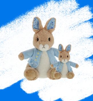 two peter rabbit toys with blue scribble background