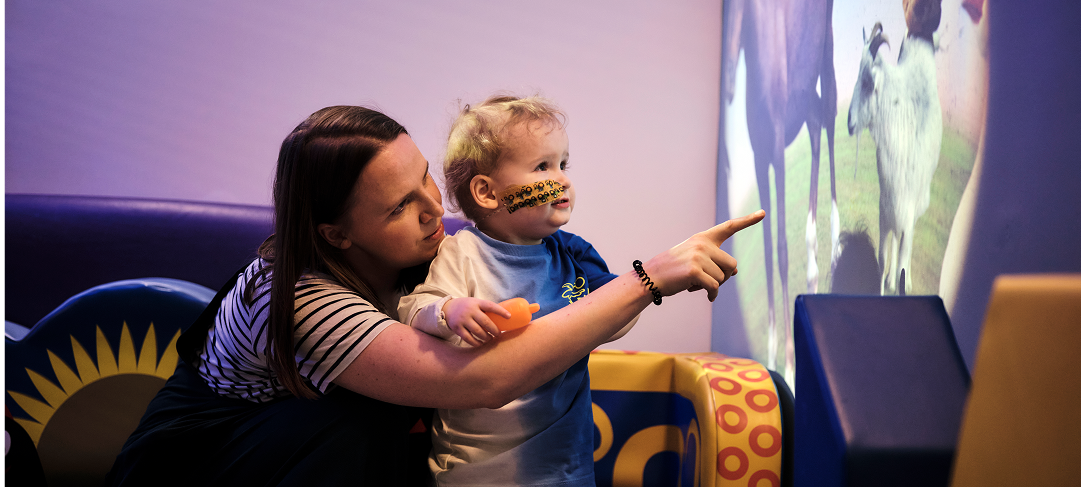 little boy with his mum playing in a play room at GOSH