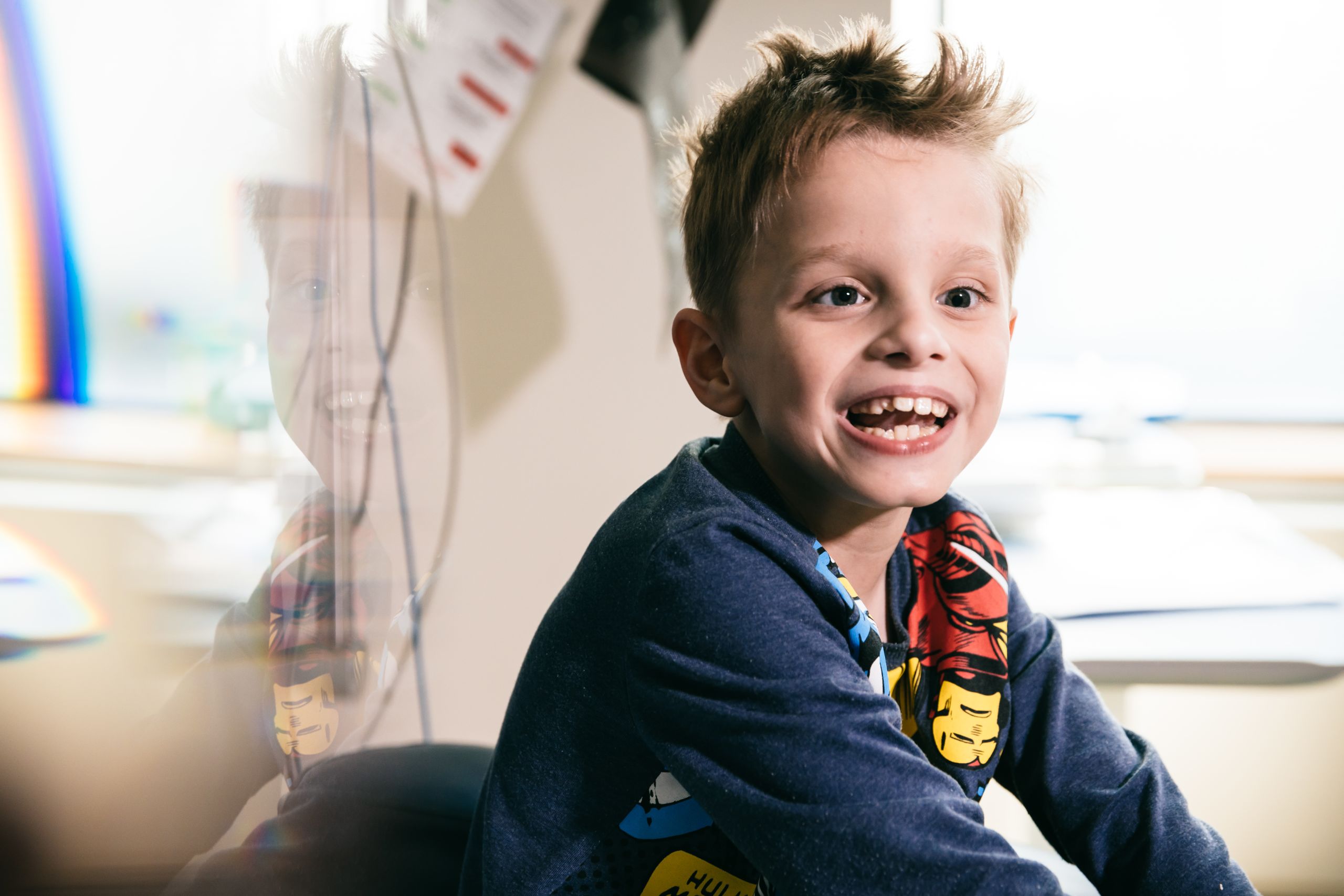 A smiling seven year old boy.