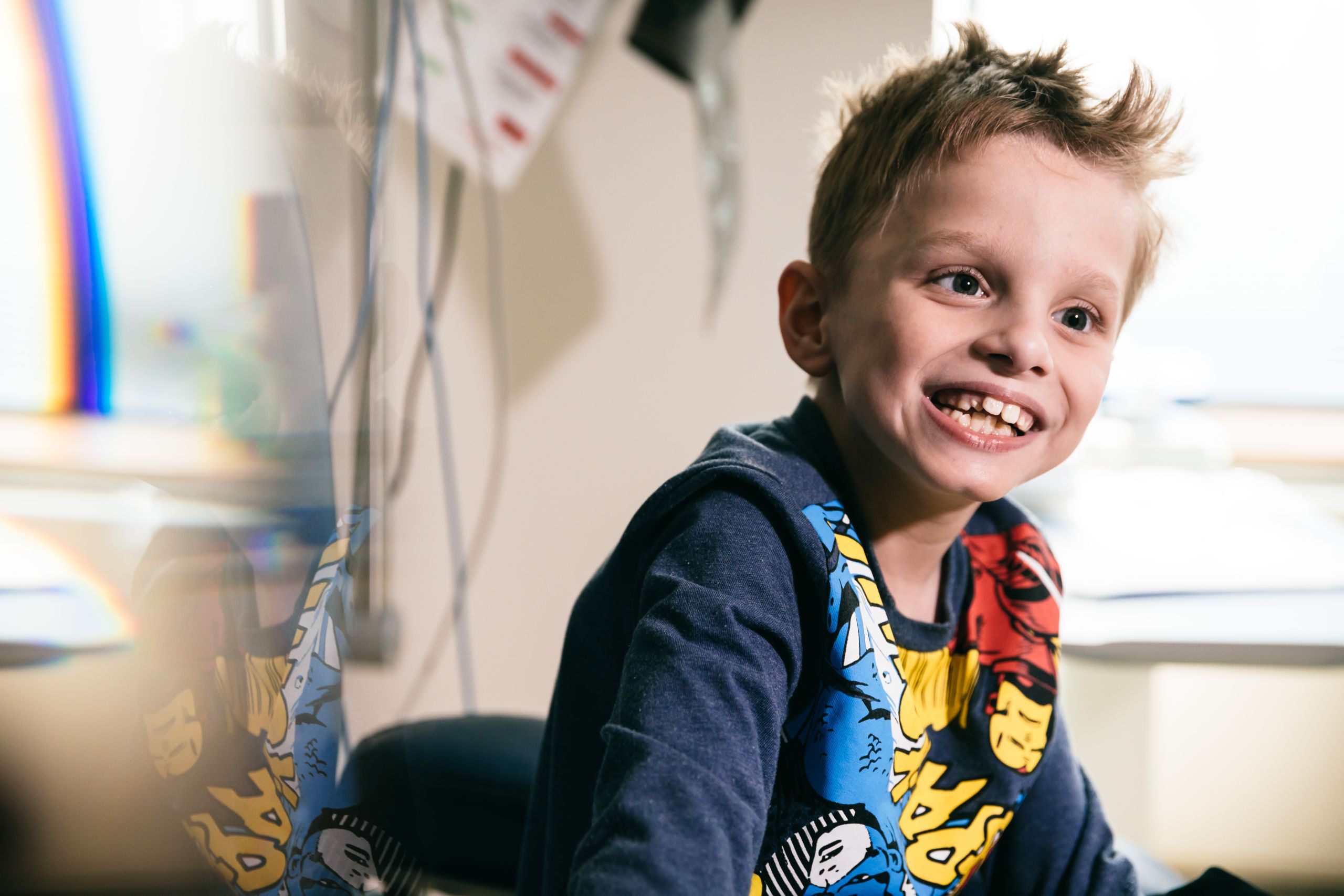 A smiling seven year old boy.